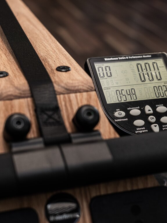 Rowing machine with digital display shows time, distance and stroke rate
