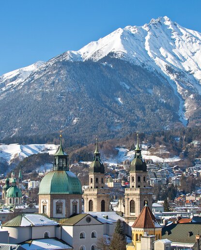 Innsbruck with snow-capped mountains in the background